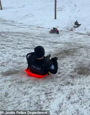 Oklahoma Police Officer's Accidental Sled Incident Goes Viral as Part of Public Safety Campaign