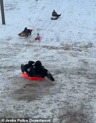 Oklahoma Police Officer's Accidental Sled Incident Goes Viral as Part of Public Safety Campaign