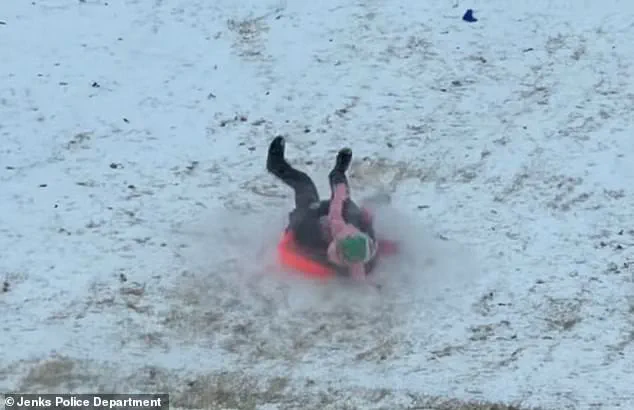 Oklahoma Police Officer's Accidental Sled Incident Goes Viral as Part of Public Safety Campaign