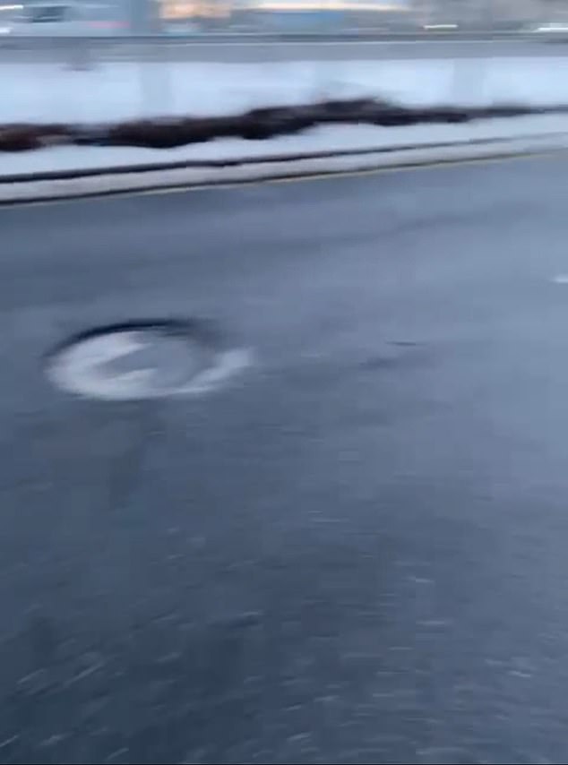 Brooklyn Tire Technician Rakes in Cash as Unaddressed Pothole Becomes Commuters' Nightmare