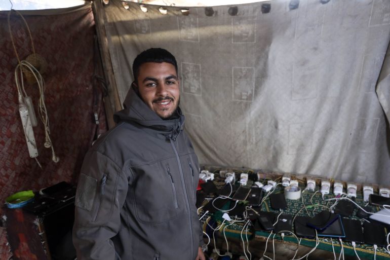 Gazans rely on smartphones for light as war destroys power grid.
