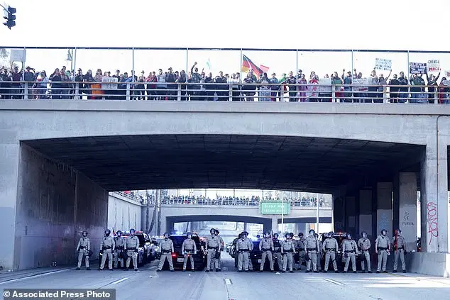 Mexican flag-waving protestors clash with police during Grammy Awards